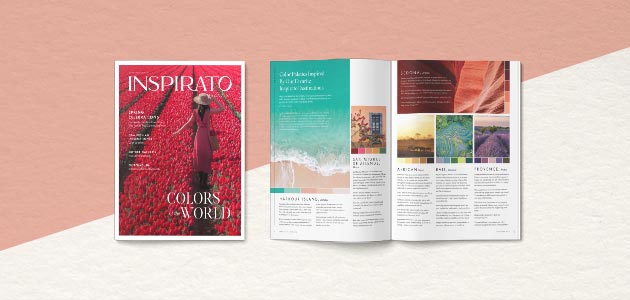 A vibrant floral magazine cover sits next to an open spread, with lush photography of far-off destinations and clean columns of text.